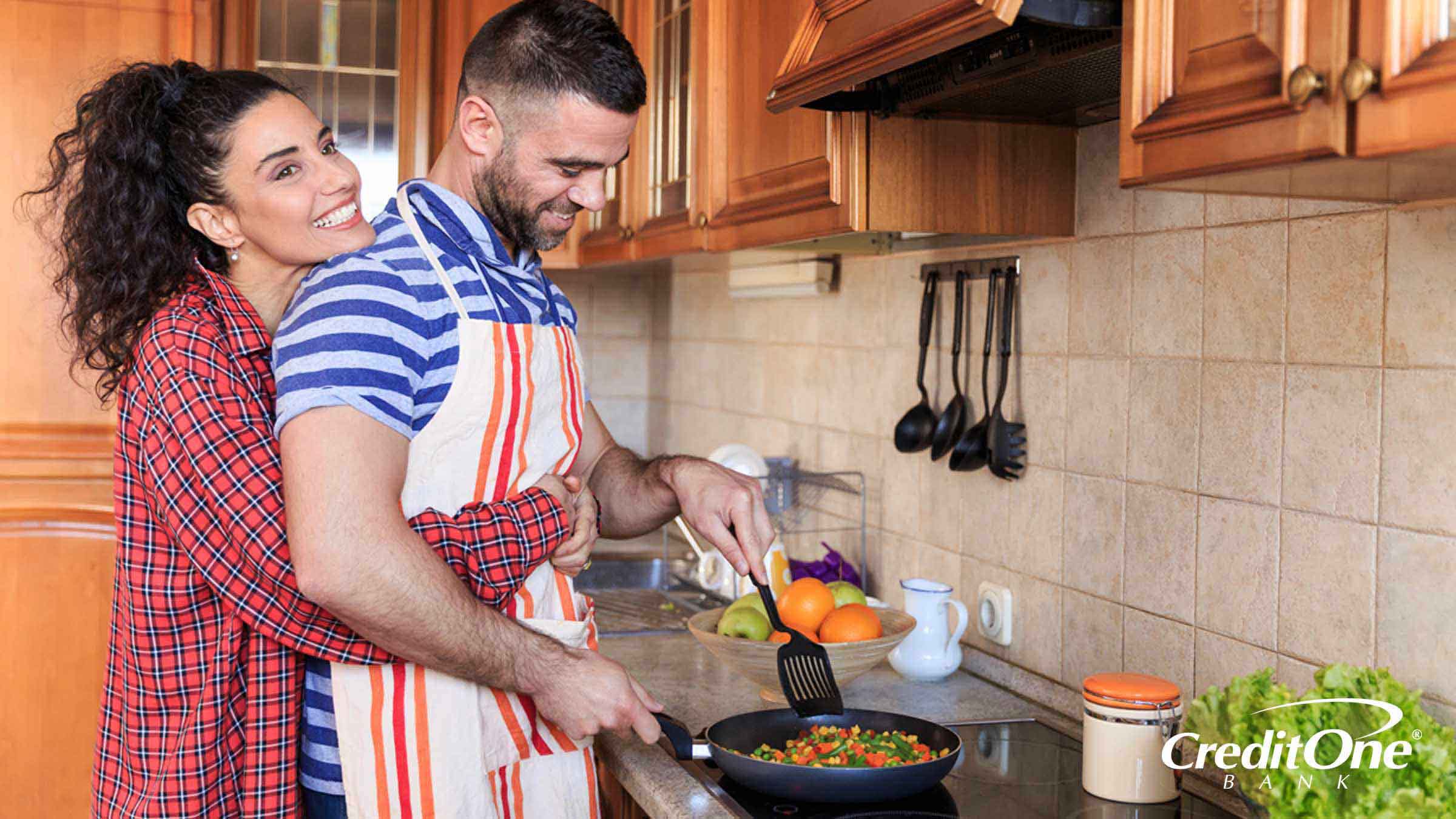 Couple cooking breakfast together